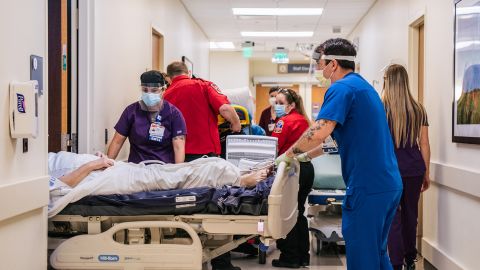 Nurses and EMTs tend to patients in the hallways at the Houston Methodist The Woodlands Hospital on August 18, 2021. 