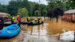 In this image provided by New Hanover County Fire Rescue, members of North Carolina's Task Force 11, based in New Hanover County, are shown during rescue efforts in Canton, N.C, on Tuesday, Aug. 17, 2021. Authorities said that dozens of water rescues were performed after the remnants of Tropical Storm Fred dumped rain on the mountains of North Carolina. 
