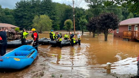 Rescuers stand in floodwater Canton, North Carolina, earlier this week.  