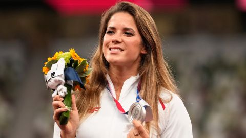 Silver medalist Maria Andrejczyk poses on the podium during the medal ceremony for the women's javelin throw at the 2020 Summer Olympics.