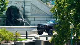 A pickup truck is parked on the sidewalk in front of the Library of Congress' Thomas Jefferson Building, as seen from a window of the U.S. Capitol, Thursday, Aug. 19, 2021, in Washington. A man sitting in the pickup truck outside the Library of Congress has told police that he has a bomb, and that's led to a massive law enforcement response to determine whether it's an operable explosive device. (AP Photo/Alex Brandon)