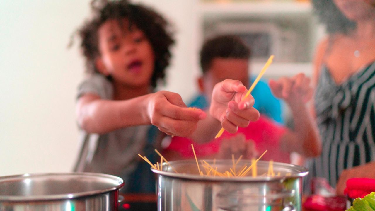 Preparing pasta dishes is a great way to introduce your children to cooking and let them be creative.