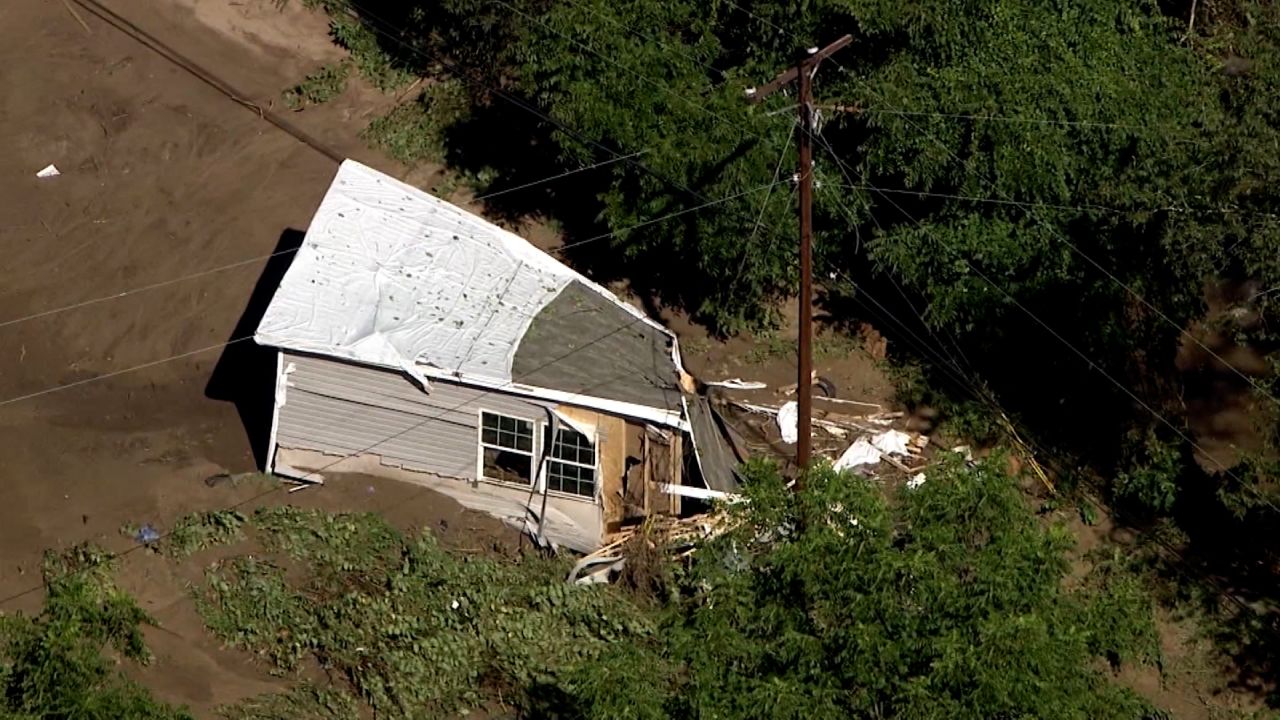 Floodwater laps up against a damaged home in Canton, North Carolina, on Wednesday.