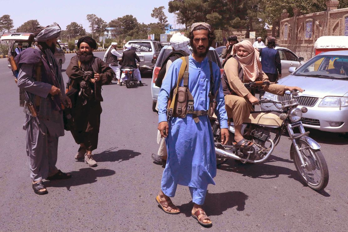 Taliban fighters patrol the streets in Herat on August 14.