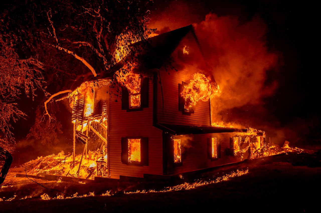 A home is engulfed by the Dixie Fire near Janesville, California, on Monday, August 16. <a href="http://www.cnn.com/2021/07/19/us/gallery/western-wildfires-2021/index.html" target="_blank">Dozens of large wildfires</a> are raging across the western United States as the region experiences a historic and unrelenting drought.