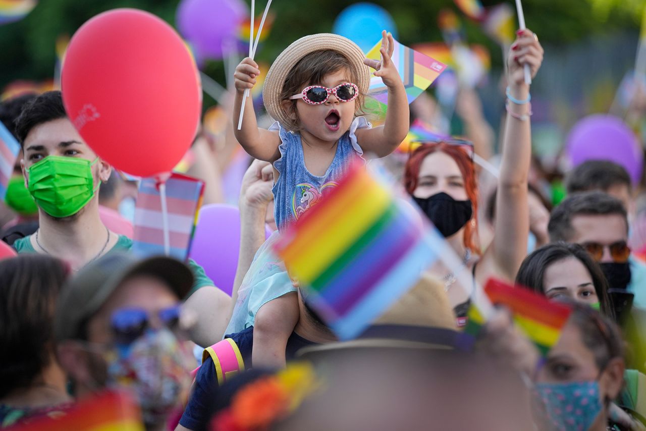 A child cheers during a Pride march in Bucharest, Romania, on Saturday, August 14.