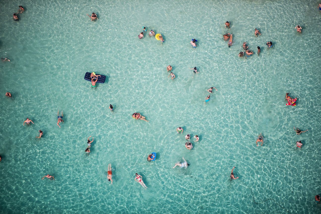 This aerial photo shows people enjoying the water in Siracusa, Italy, as temperatures soared on the island of Sicily on Sunday, August 15. A few days earlier, authorities said Siracusa <a href="https://www.cnn.com/2021/08/12/europe/europe-weather-heat-record-climate-intl/index.html" target="_blank">may have set an all-time heat record for Europe,</a> hitting a temperature of 48.8 degrees Celsius (119.8 degrees Fahrenheit).