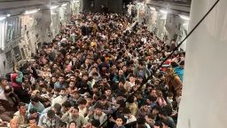 Afghan citizens pack inside a U.S. Air Force C-17 Globemaster III, as they are transported from Hamid Karzai International Airport in Afghanistan, Sunday, Aug. 15, 2021.  The Taliban on Sunday swept into Kabul, the Afghan capital, after capturing most of Afghanistan. (Capt. Chris Herbert/U.S. Air Force via AP)