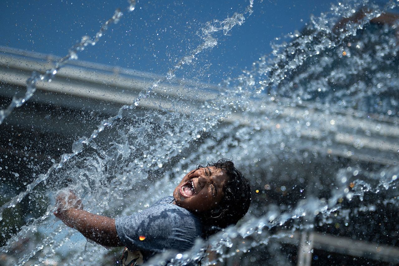 Micaela Montelara plays in a fountain at the Georgetown Waterfront Park in Washington, DC, on Friday, August 13.