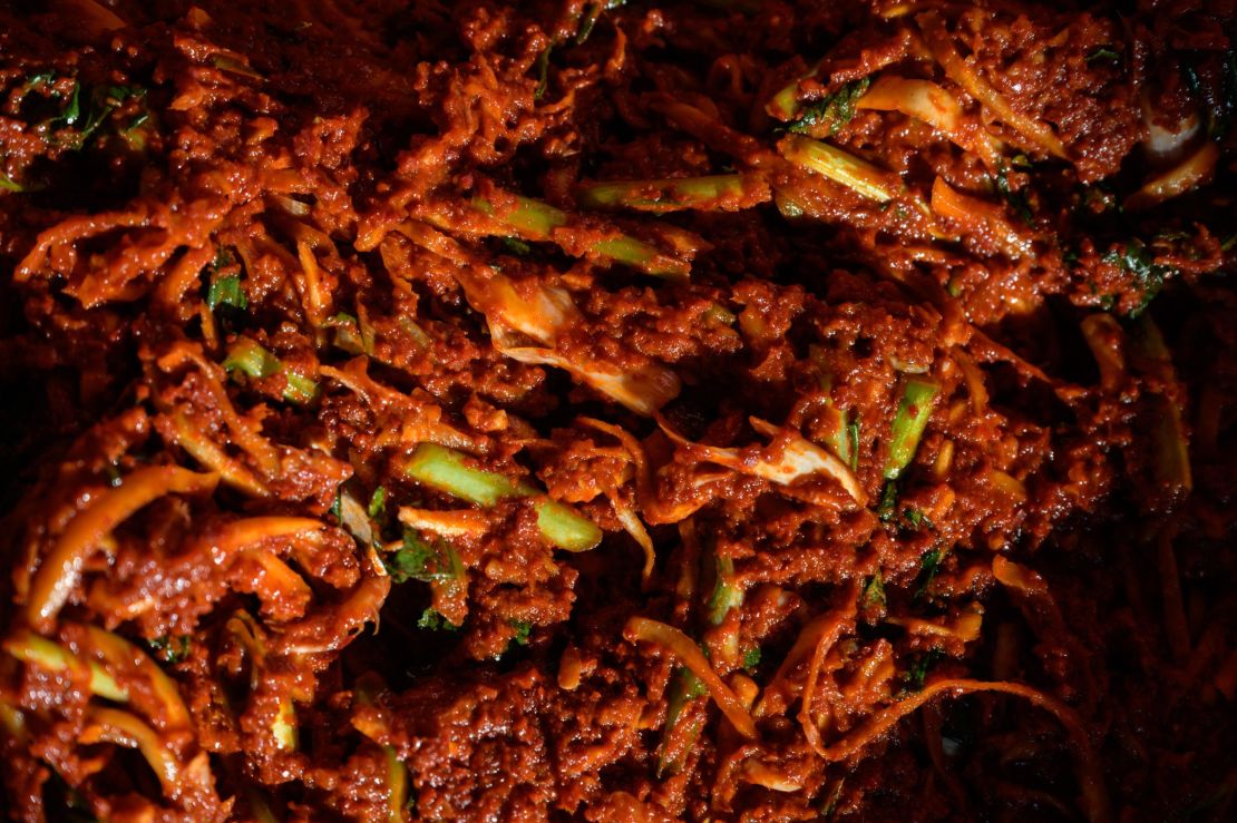 A spicy sauce used to make kimchi is prepared during a traditional process known as 'kimjang', at a home in the South Korean port city of Donghae in 2020. 