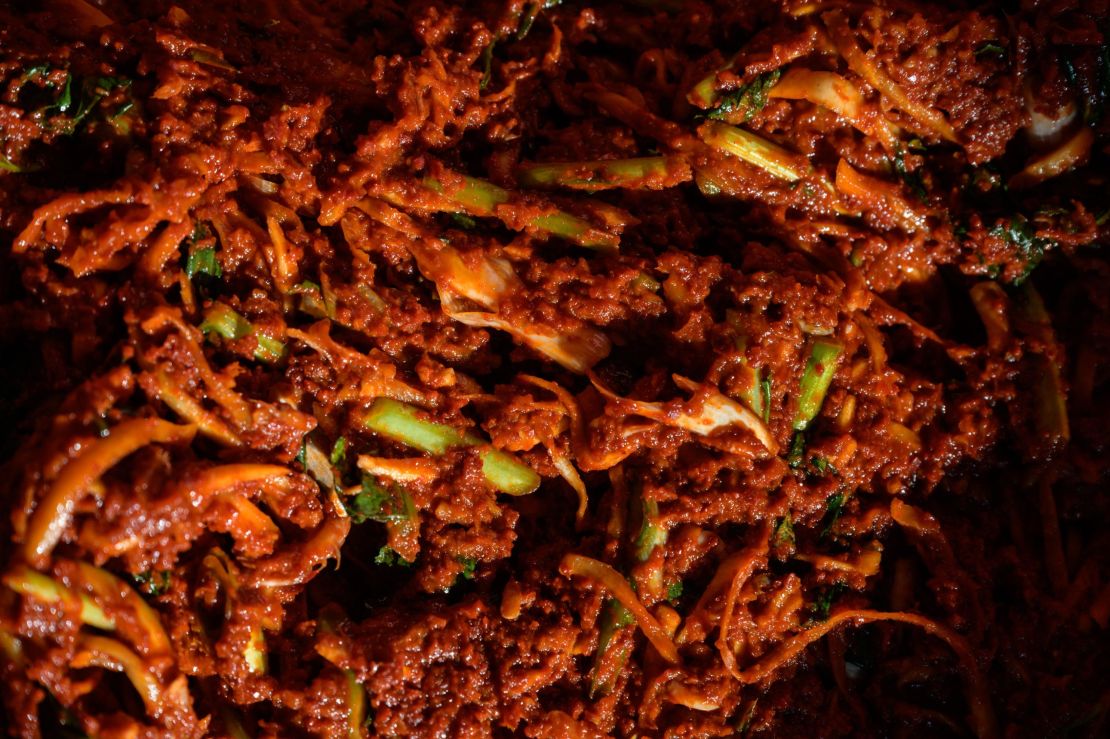 A spicy sauce used to make kimchi is prepared during a traditional process known as 'kimjang', at a home in the South Korean port city of Donghae in 2020.