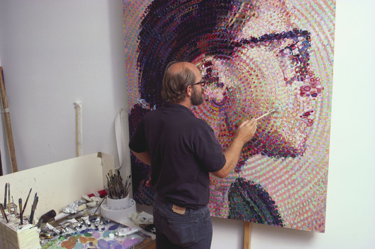 American artist Chuck Close works on his painting 'Cindy II,' a portrait of fellow artist Cindy Sherman, in  1988.