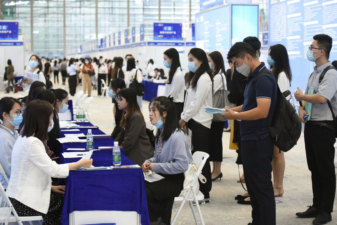 University graduates crowd at a job fair at Shenzhen Convention and Exhibition Center on October 10, 2020, in Shenzhen, Guangdong province of China. 