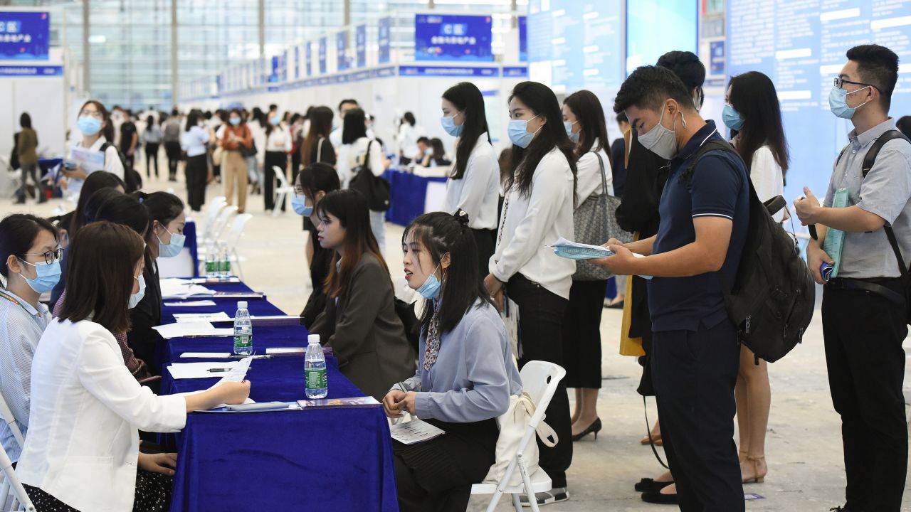 University graduates crowd at a job fair at Shenzhen Convention and Exhibition Center on October 10, 2020, in Shenzhen, Guangdong province of China.