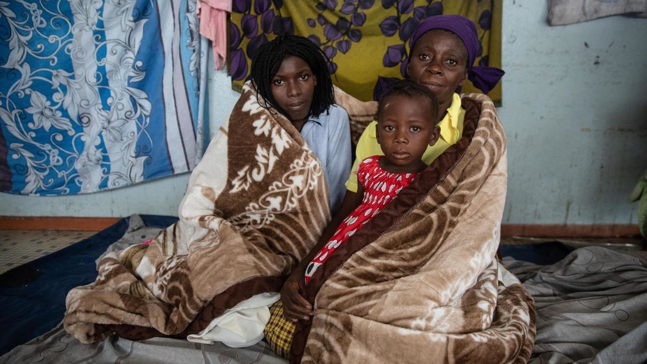 Residents of the Praia Nova neighborhood in Beira, Mozambique take shelter from tropical cyclone Eloise.