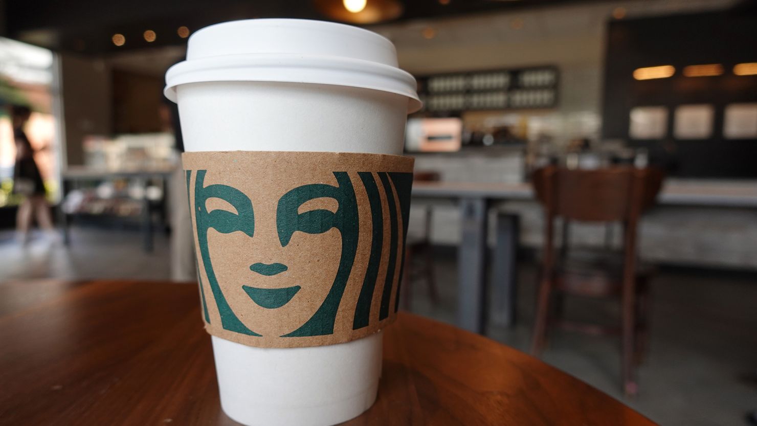 A Starbucks coffee cup sits on a table on June 11, 2021 in Miami, Florida. 