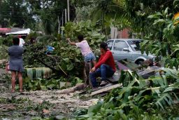 Locals remove debris from their homes after the passage of Hurricane Grace, in Tulum, Quintana Roo state, Mexico, on Thursday, August 19, 2021.