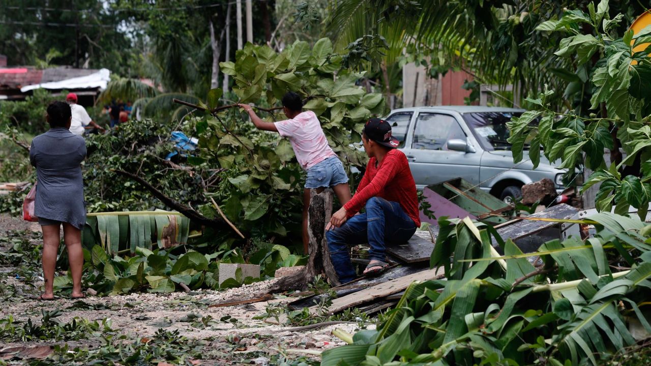 Locals remove debris from their homes after the passage of Hurricane Grace, in Tulum, Quintana Roo state, Mexico, on Thursday, August 19, 2021.