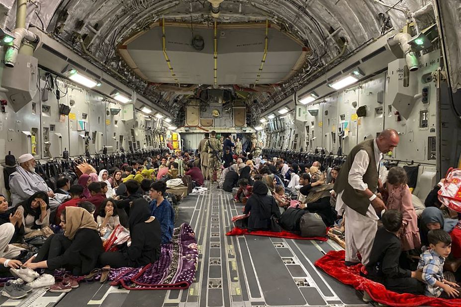 Afghans sit inside a US military aircraft to leave Kabul on August 19. The US Air Force <a href="https://www.cnn.com/world/live-news/afghanistan-taliban-us-news-08-20-21/h_e066c6b39a904ab84d766a8f77176b1f" target="_blank">evacuated approximately 3,000 people from Kabul's international airport that day,</a> according to a White House official. Nearly 350 US citizens were among the evacuees, the official said, with the others being family members of US citizens, Special Immigrant Visa applicants and their families, and other vulnerable Afghans. Some civilian charter flights had also departed the Kabul airport in the previous 24 hours.