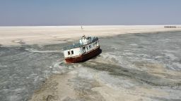 The ferry boats many used to cross the lake lies stranded on the salty crust, slowing rusting away. 