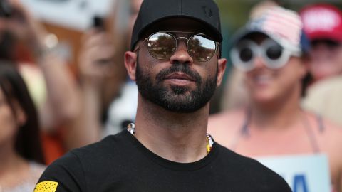 Enrique Tarrio, leader of the Proud Boys, stands outside of the Hyatt Regency where the Conservative Political Action Conference was being held on February 27, 2021 in Orlando, Florida.