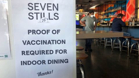 A proof of vaccination sign is posted at a San Francisco bar on July 29, 2021