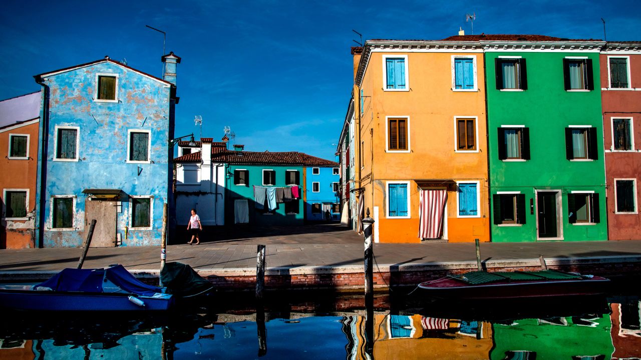 Canalside houses on Burano island in Venice Lagoon.