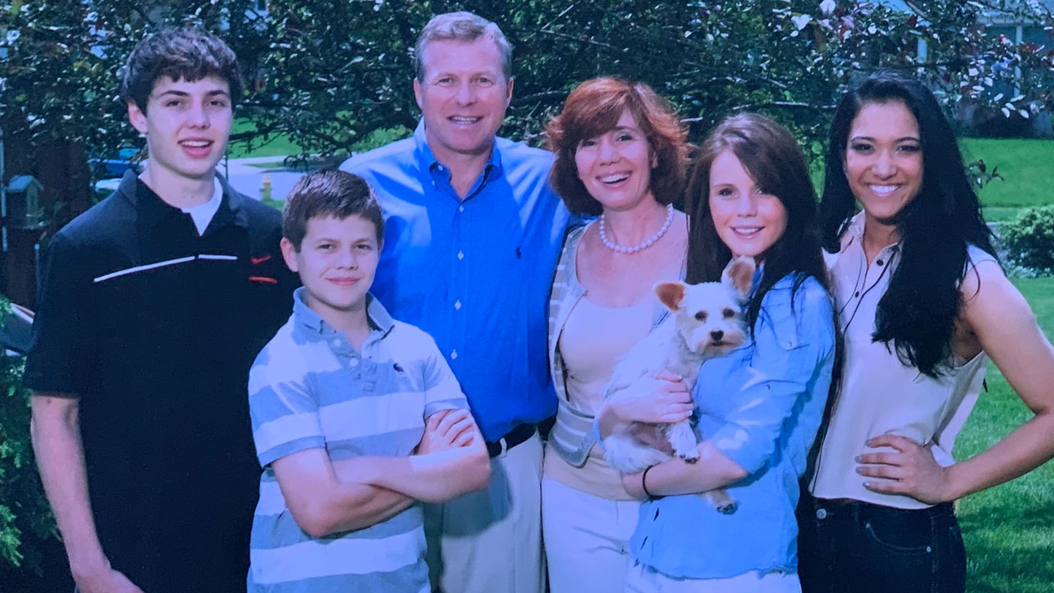 Charlie Dent, his wife Pamela Dent, his children William Dent (far left), Jack Dent (left) and Kathryn Dent (right) holding Yogi the dog, and Afghan refugee Samiya Azizi (far right) in December 2011.