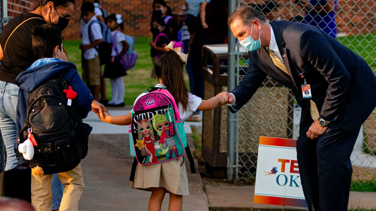 Oklahoma City Public School Superintendent Dr. Sean McDaniel gives fist bumps to students as they arrive at Rockwood Elementary for Oklahoma City Public Schools first day of class on Monday, Aug. 9, 2021, in Oklahoma City, Oklahoma.