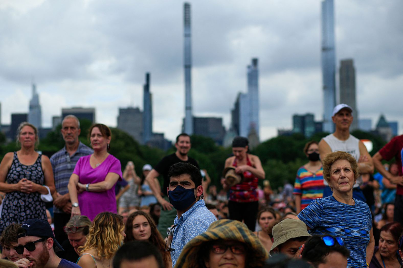 Spectators wait for the concert to begin.