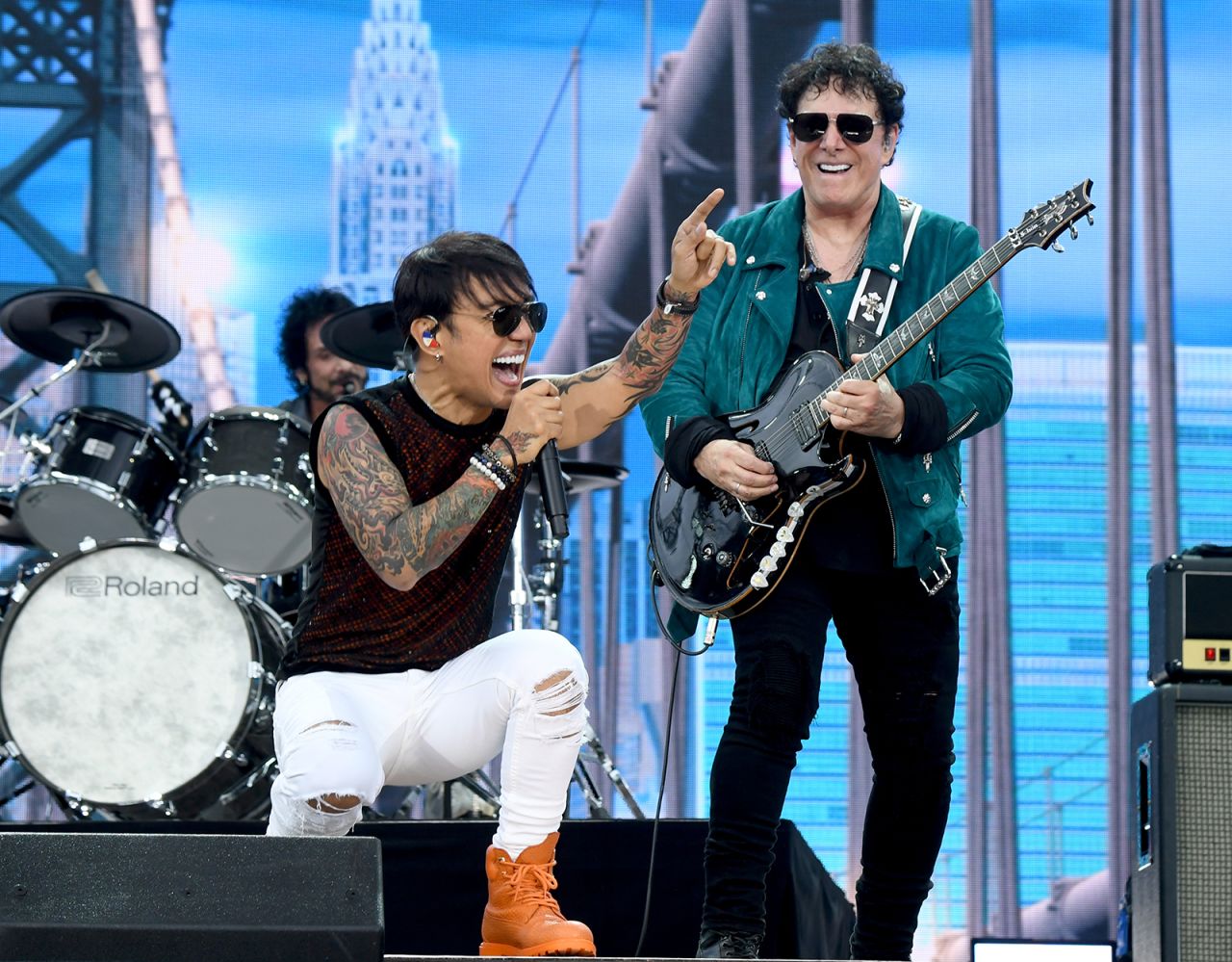 Arnel Pineda and Neal Schon of Journey perform "Don't Stop Believin'."