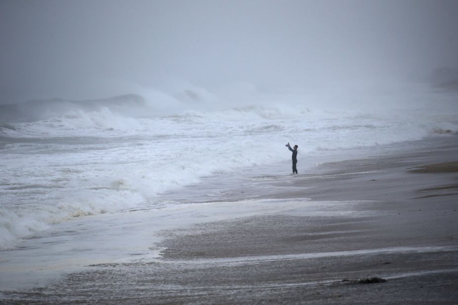 Matt Prue takes photos of waves in Westerly, Rhode Island, on August 22. The storm made landfall near Westerly.
