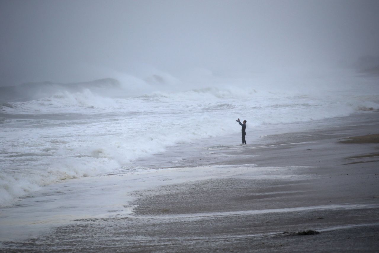 Matt Prue takes photos of waves in Westerly, Rhode Island, on August 22. The storm made landfall near Westerly.