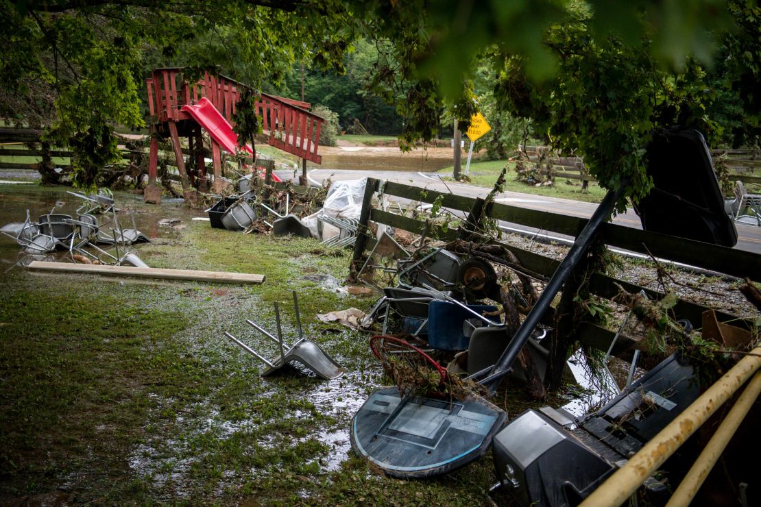 Debris from flooding is strewn along Sam Hollow Road following heavy rainfall on Saturday, August 21, in Dickson, Tennessee.