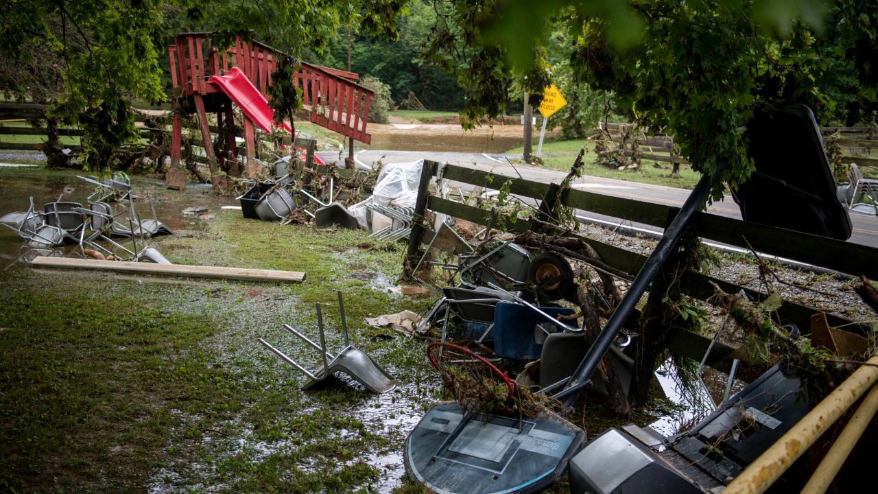 Debris from flooding is strewn along Sam Hollow Road following heavy rainfall on Saturday, August 21, in Dickson, Tennessee.