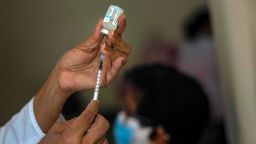FILE - In this June 23, 2021 file photo, a nurse prepares a dose of the Cuban Abdala COVID-19 vaccine in Havana, Cuba. Cuba has been trying to rapidly roll out the two vaccines that it has approved for massive use, Abdala and Soberana, both of which require three jabs. (AP Photo/Ramon Espinosa, File)
