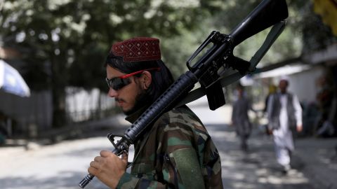 A Taliban fighter stands guard at a checkpoint in the Wazir Akbar Khan neighborhood in the city of Kabul, Afghanistan, Sunday, Aug. 22, 2021.