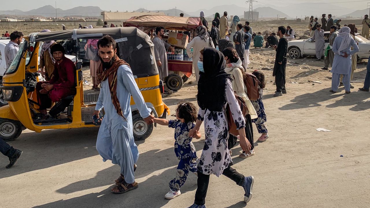 People waiting outside the north gate of Kabul airport on August 21.