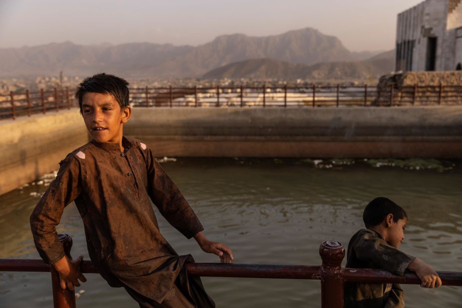 Boys play in a retention pool in Kabul on August 22, at the tomb of Mohammed Nadir Shah, a former king of Afghanistan.