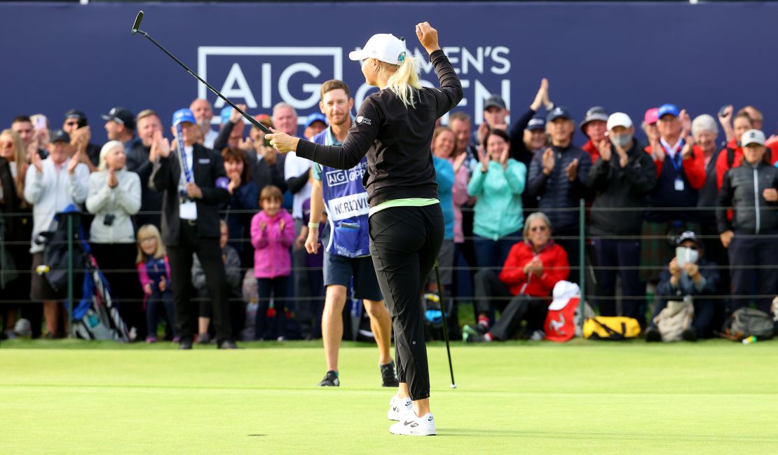 Nordqvist celebrates on the 18th green with her caddie.