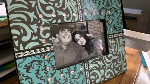 A framed photo of Carla and Sammy Balderas sits on Carla's desk at the city building. Carla has been in quarantine with her young son, while her husband was hospitalized with Covid-19. Sammy Balderas passed away on August 19.