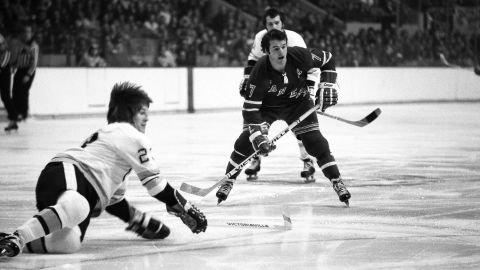 Rod Gilbert #7 of the New York Rangers plays against the Boston Bruins Al Sims #23.