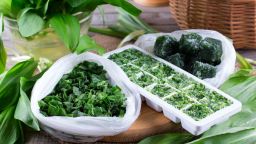 One way to preserve herbs is to freeze them with water or olive oil in an ice cube tray.