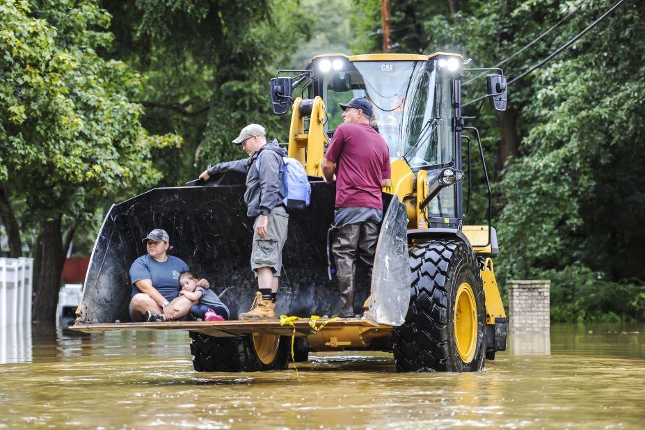 From left, Andrea Fuchs; her daughter, Sozey; and her husband, Saun, get a ride to her parents' home in Monroe, New Jersey.