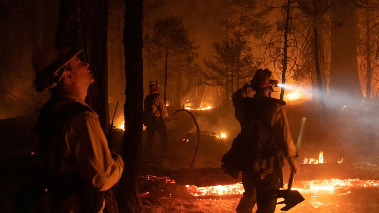 Firefighters battle flames during the Caldor Fire in Kyburz, California, on August 21.