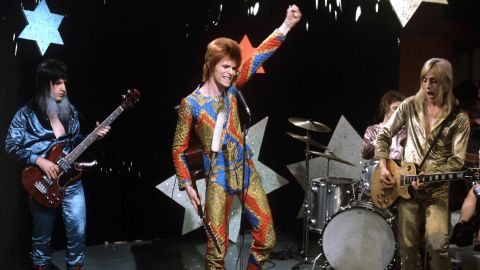 Get ready for the next spacewalk outside the International Space Station with a far-out song list. David Bowie (center) performs with Trevor Bolder (left) and Mick Ronson (right), circa 1972.