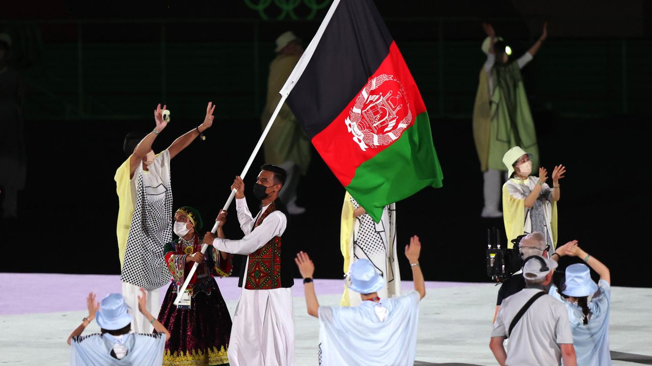Flag bearers of Team Afghanistan during the Opening Ceremony of the Tokyo 2020 Olympic Games.