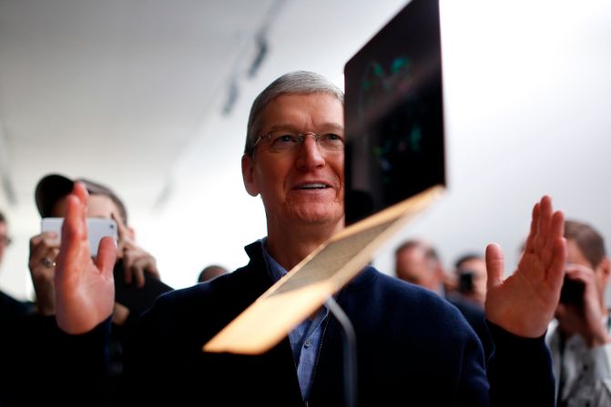 Cook stands in front of a MacBook display after an Apple special event in San Francisco in March 2015. 