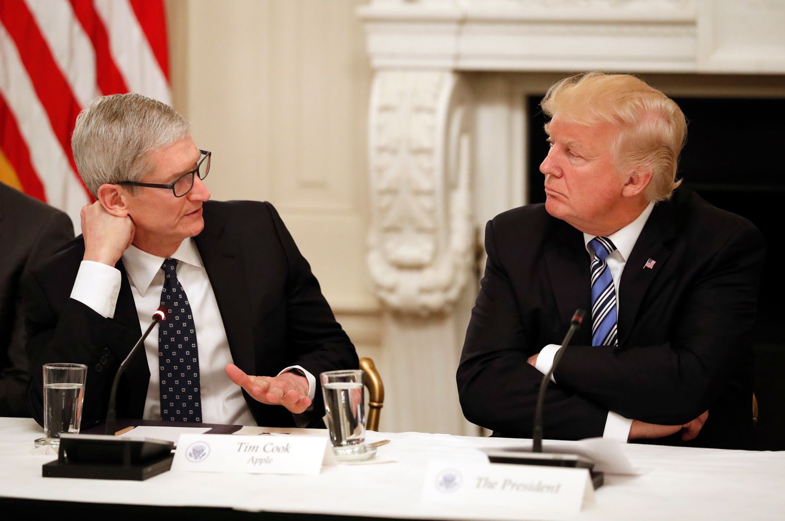 President Donald Trump listens as Cook speaks during an American Technology Council roundtable at the White House in June 2017.