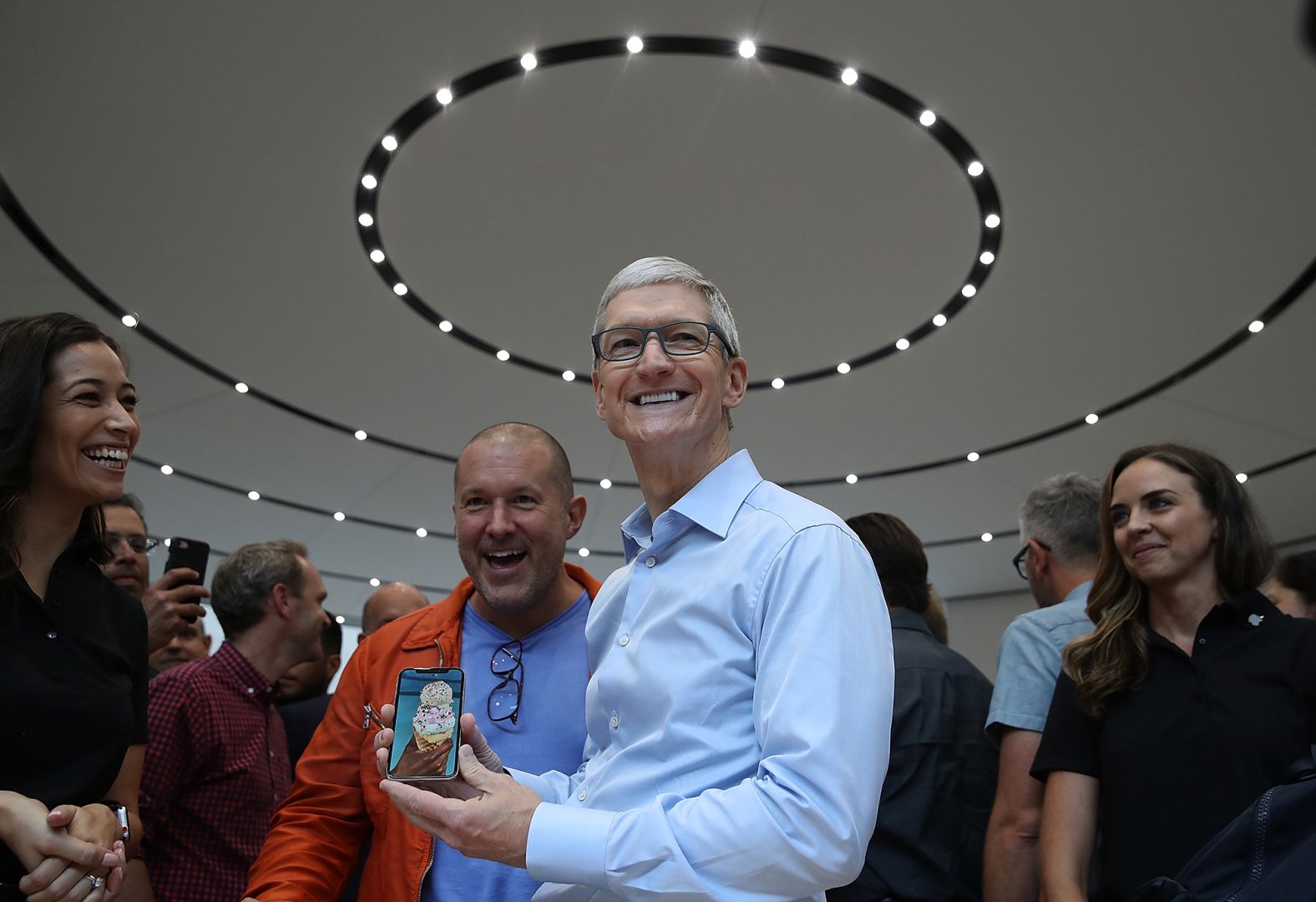 Cook and Apple chief design officer Jonathan Ive look at the new Apple iPhone X during an Apple special event in September 2017.